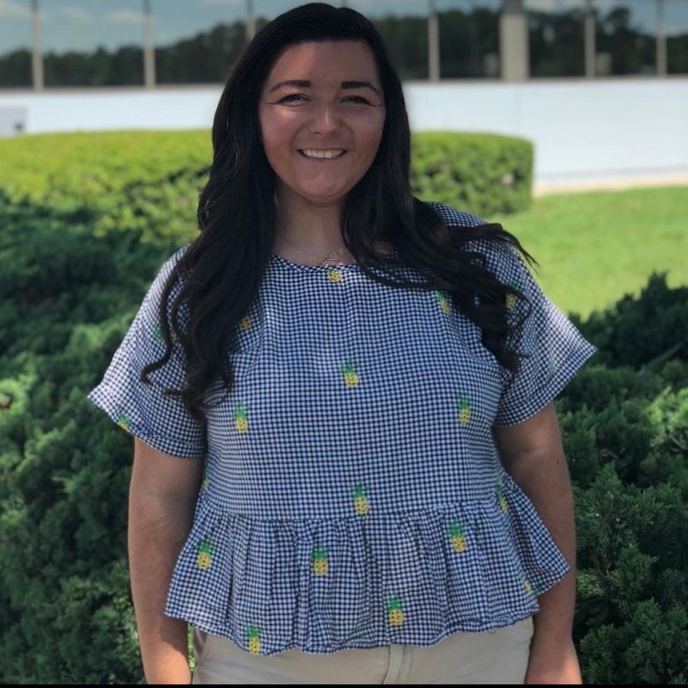 Plaid top with pineapple embroidery and ruffle hem